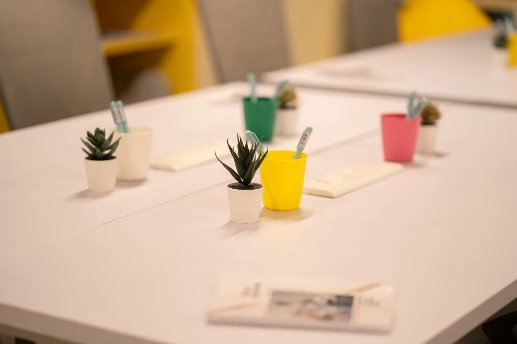Teloz Spaces private coworking office with yellow accent wall